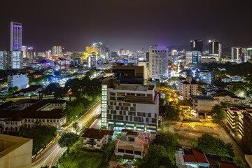 Obraz premium Aerial night panorama view of Penang cityscape with illuminated building and busy circulation streets