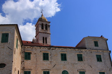 Fototapeta na wymiar Croatia, Šibenik - the Franciscan monastery with the bell tower of the 14th-century church of St. Francis.