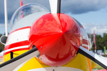 Turbo-jet engine red screw of a close-up of a light-engine aircraft.