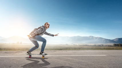 Teenager girl ride her skateboard. Mixed media