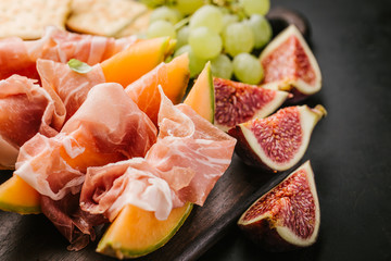 Mediterranian appetizers on old wooden table