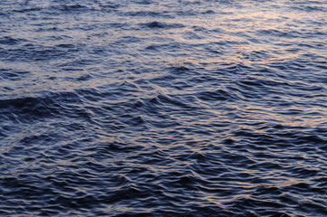 waves on the river in the sunset light
