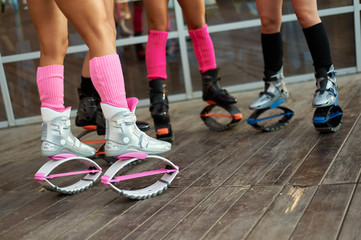 Fototapeta na wymiar group of womens legs in kangoo jumps boots