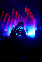 Use advanced mobile recording, fun concerts and beautiful lighting, Candid image of crowd at rock...