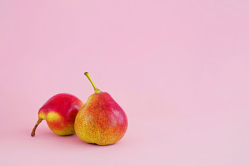 Group of rape pears on pale pink background