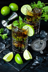 Cool  Cuba libre  in glasses on  dark table