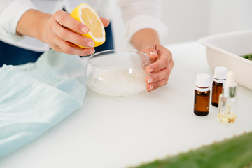 Woman preparing an aloe vera gel recipe with essences. Healthy, natural and cosmetic concept