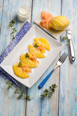 pineapple salad with smoked salmon and lemon peel