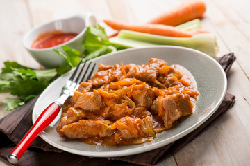 meat stew with tomatoes carrots and leeks