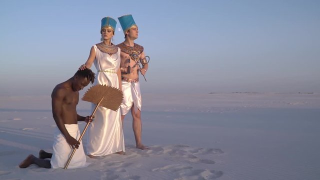 The royal couple of the ancient Egypt, the queen strokes her slave