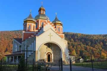 christian church in autumn landscape