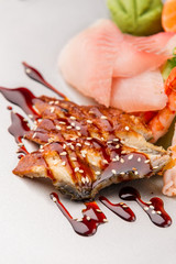 Eels with unagi sauce and sesame