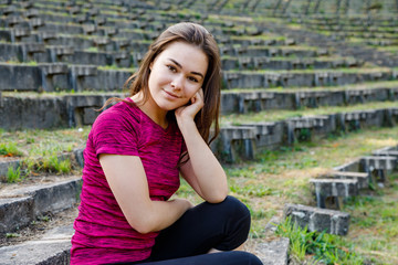 Portrait of woman exercising in park