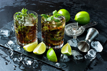 Alcoholic cocktail with rum, lime, mint and ice. Selective focus