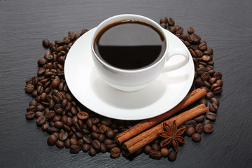 Cup of coffee with cinnamon and star anise