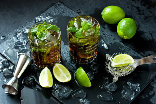 Cuba libre cocktail with rum, cola and lime, holidays party concept