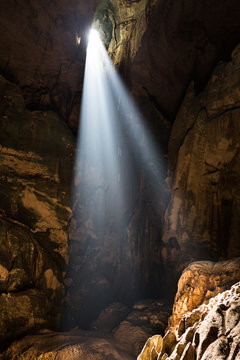 Shafts Of Sunlight From Mulu Cave Roof Illuminate The Chamber