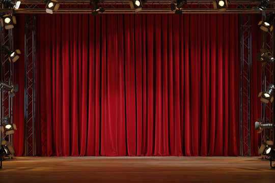 Theater stage with red velvet curtains with spotlights. 