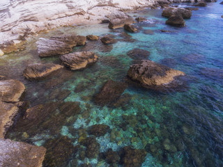 Clear turquoise water near the rocky shore of the Mediterranean sea