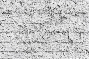 Fragment of plaster of house wall with decorative effect, white color