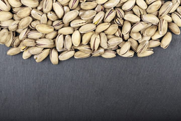 pistachios on a black background