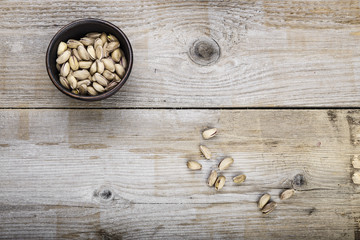 pistachios on a wooden background