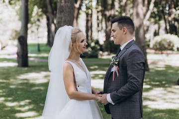 Walking newlyweds in nature.
