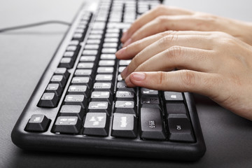 hands on a computer keyboard