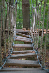 Fototapeta na wymiar Rope bridge at adventure climbing park
