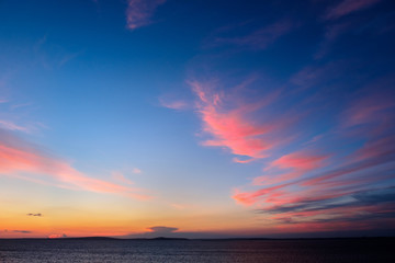 Fototapeta na wymiar Beautiful sunset over the sandy sea beach