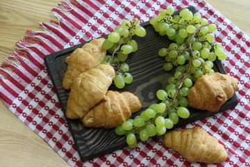 Wine, croissant, cheese.