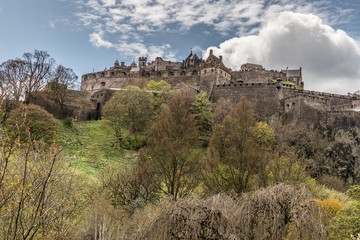Fototapeta na wymiar The famous Castle of Edinburgh under a blue sky