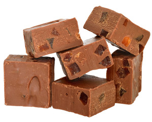 Milk chocolate cubes filled with orange candied fruit isolated