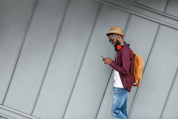 Men Fashion. Man With Phone And Headphones On Street