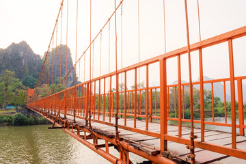 Orange bridge over song river Landmark in Vang Vieng,Laos 