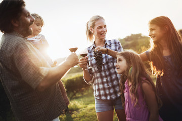 Winemaker family together in vineyard