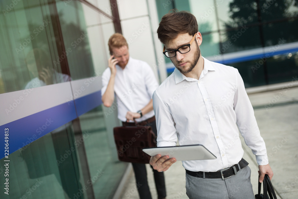 Wall mural business people walking outdoors