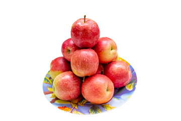 Red apple on plate. Isolated on white background