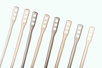 plastic sticks for stirring hot drinks isolated on white background