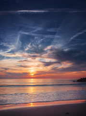 Obraz premium Grass of sand dunes and dramatic cloud during ocean seaside sunset. Rubjerg Knude Lighthouse, Lønstrup in North Jutland in Denmark, Skagerrak, North Sea