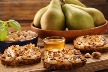 Grilled blue cheese sandwich with pears pistachios and honey