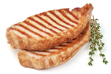 Grilled juicy pork steak, isolated on white background.