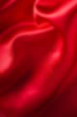 Red Satin Softly Draping Blurred Background