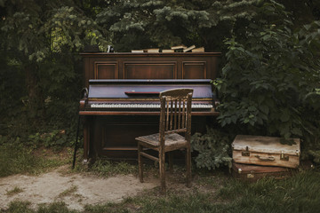 Old Vintage piano in the garden. Copy Space