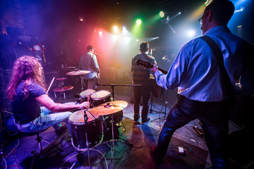 Fototapeta na wymiar Band performs on stage in a nightclub