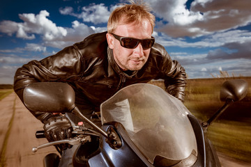 Biker racing on the road
