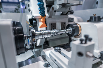 Fototapeta na wymiar Metalworking CNC milling machine. Cutting metal modern processing technology.