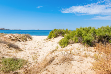 Sand dunes and sea in summer day on Naxos island, Greece
