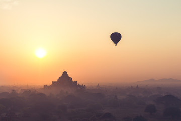 Lonely Balloon with sunrise over the ancient temples in Bagan, Myanmar