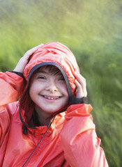 Portrait of little girl smiling outside